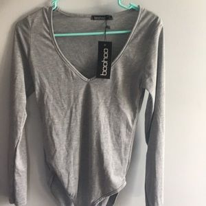 LONG SLEEVE V NECK BODYSUIT. BRAND NEW NEVER WORN